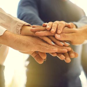 3 people hand together
