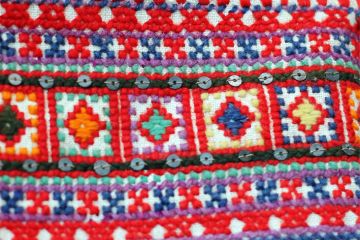 close of fabric with kutch embriodery work