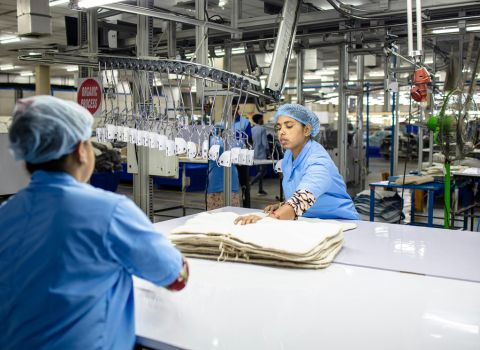 inside a garment factory folding the garments
